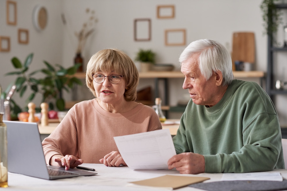A senior couple working on their finances for memory care in Cedar Rapids, Iowa