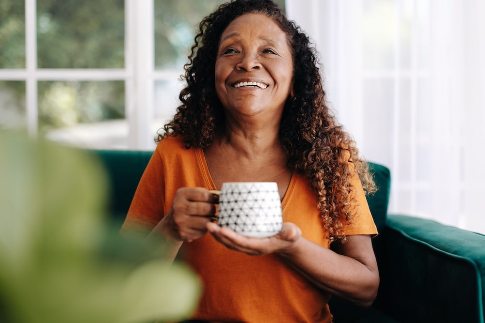 A senior woman relaxing with a cup of coffee