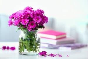 An arrangement of purple flowers in a vase